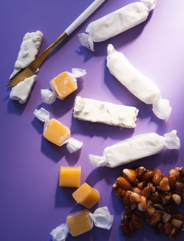 Sugar free nougat, salted caramel, and nut brittle with purple background