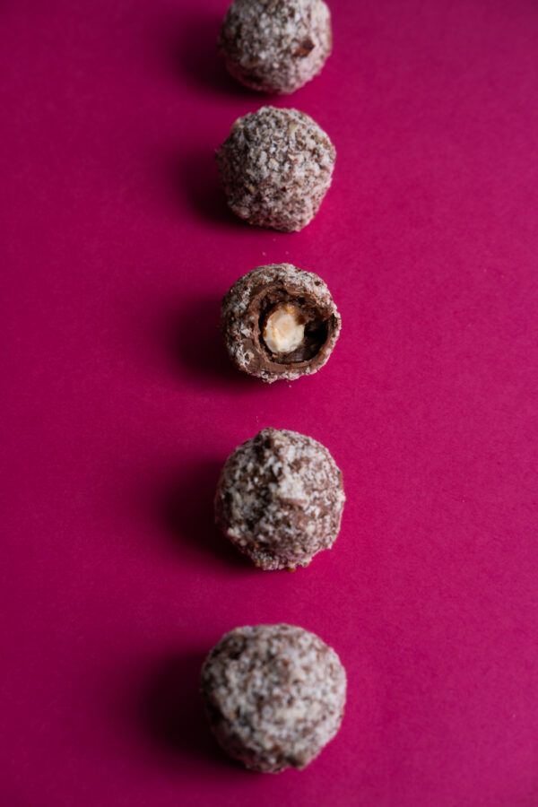 Perfectly lined sugar-free hazelnut chocolate with dark pink background