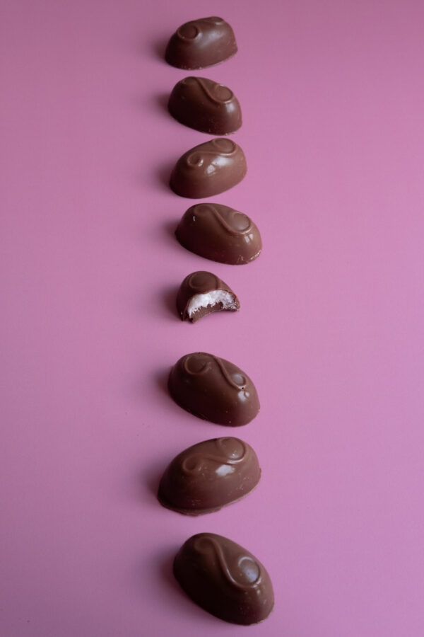 coconut nibble on light pink table